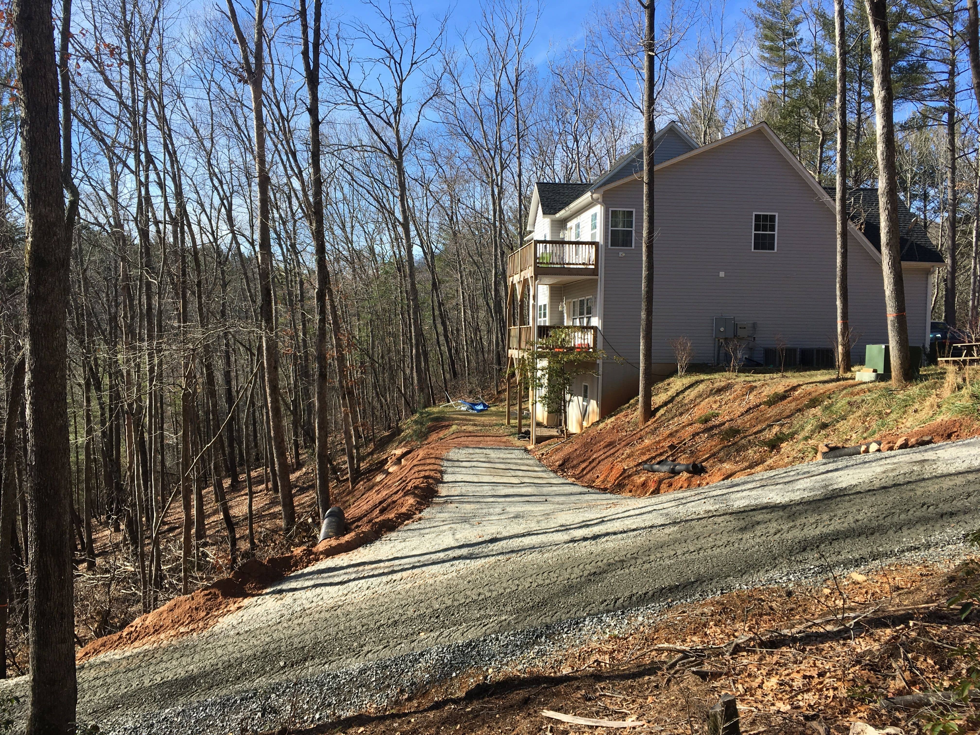 New driveway installed. Drainage pipes, ditches, underlayment, and gravel