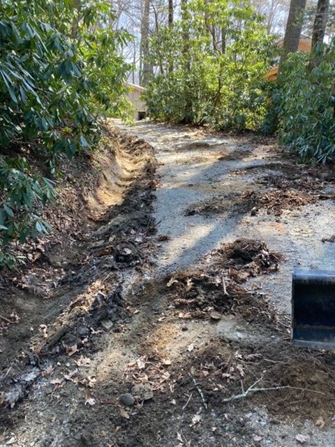 All debris removed, ditch shaped and cleaned, roadway will be re-surfaced in preperation for new material to be spread