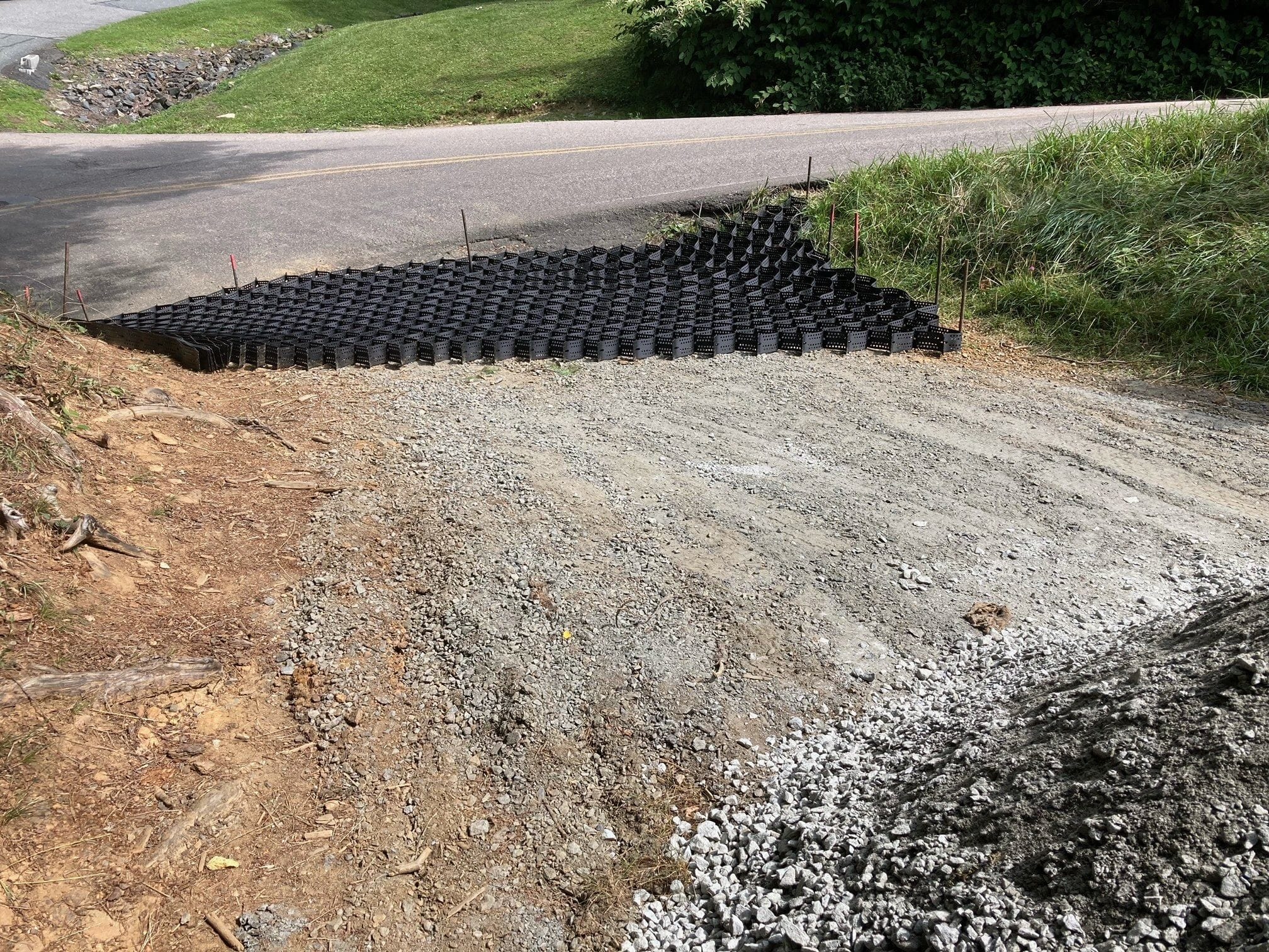 A Geo stabilization grid is used to reduce washing of gravel and erosion from pavement runoff